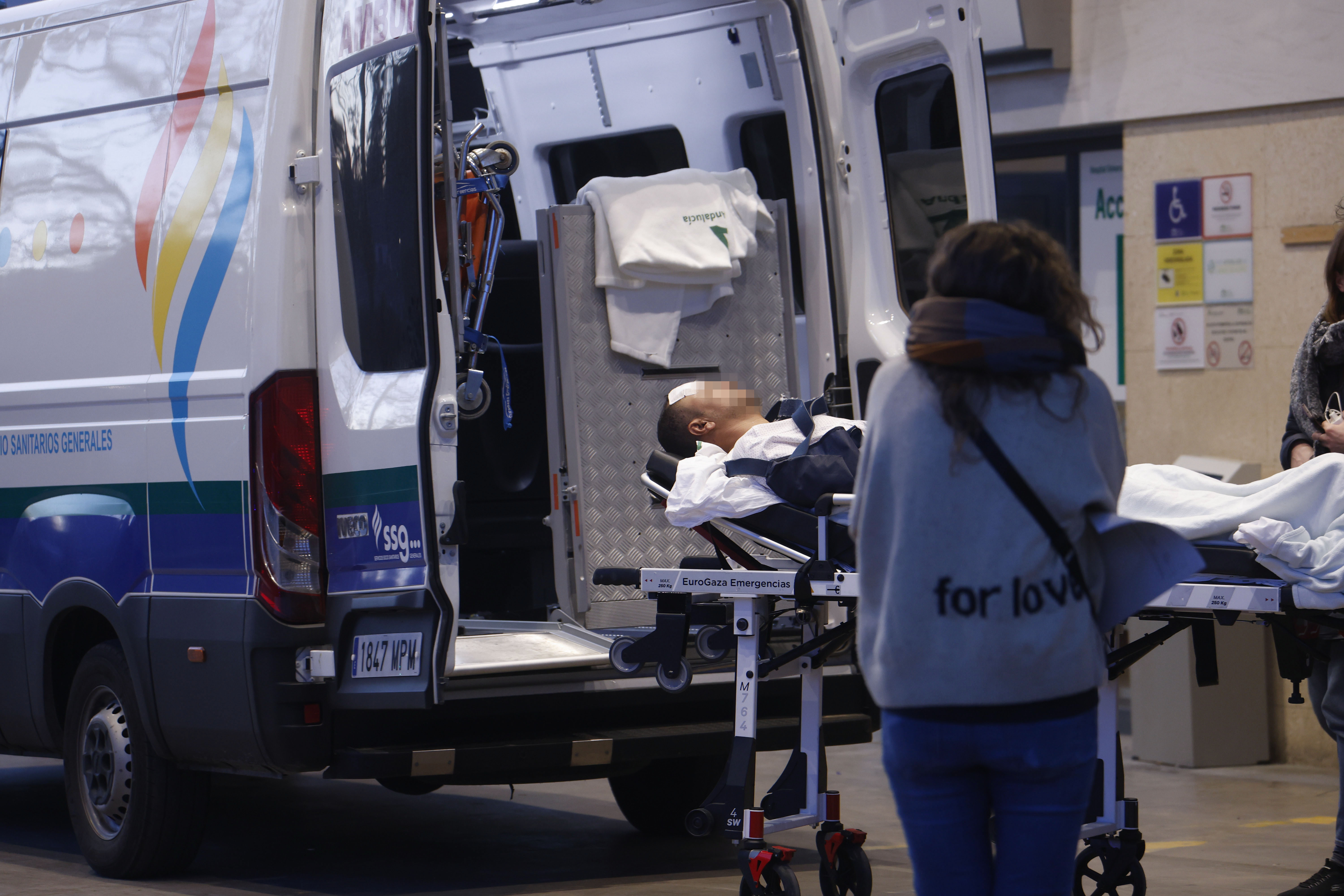 An injured passenger is taken to hospital