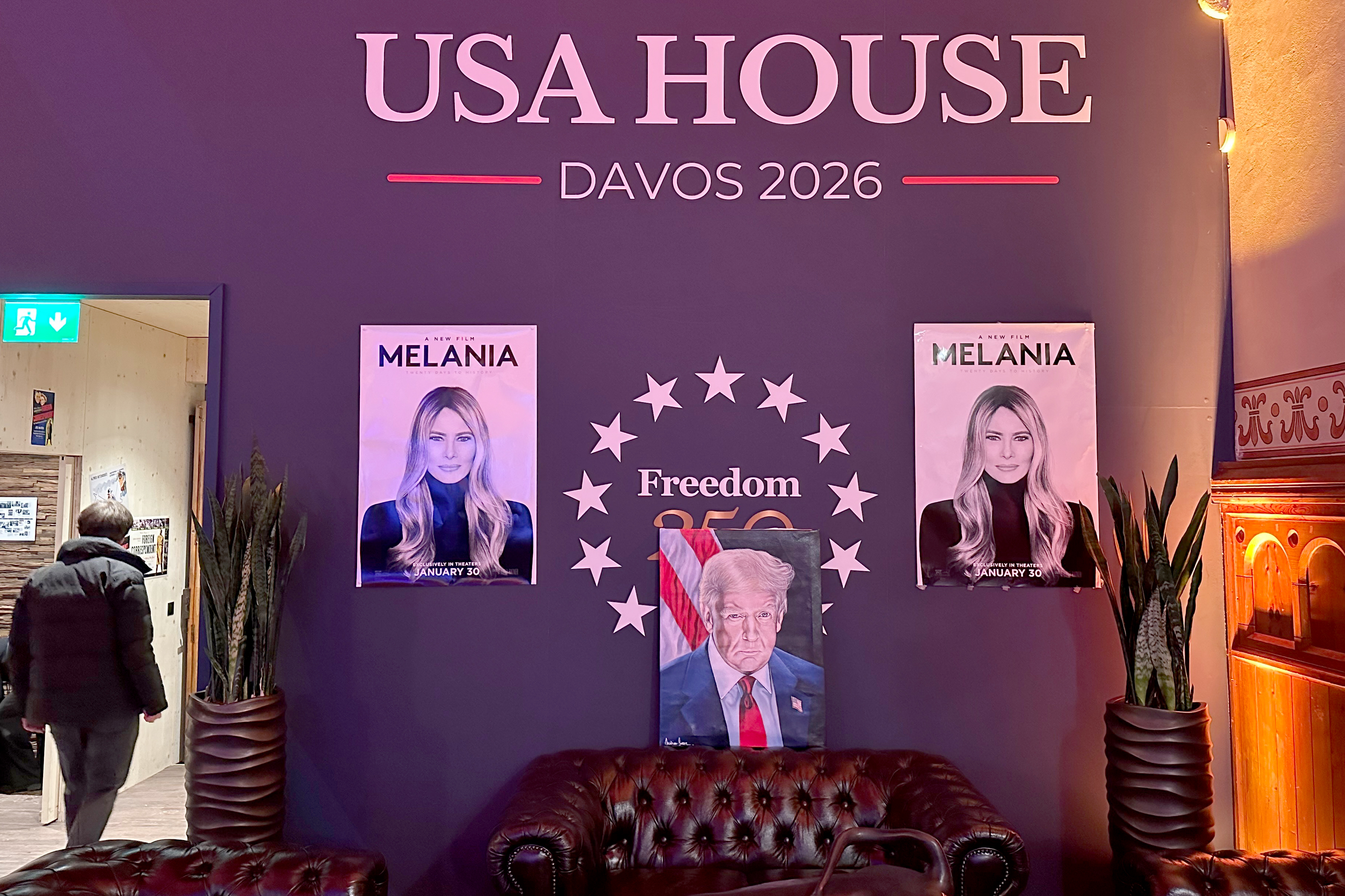 The posters for the documentary hang either side of Trump’s presidential portrait