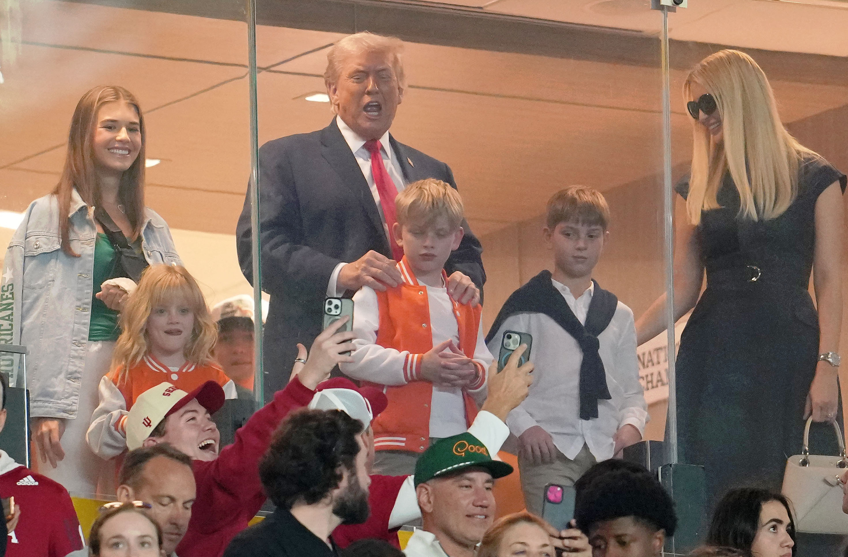 President Trump watches a college football game in Miami on Monday