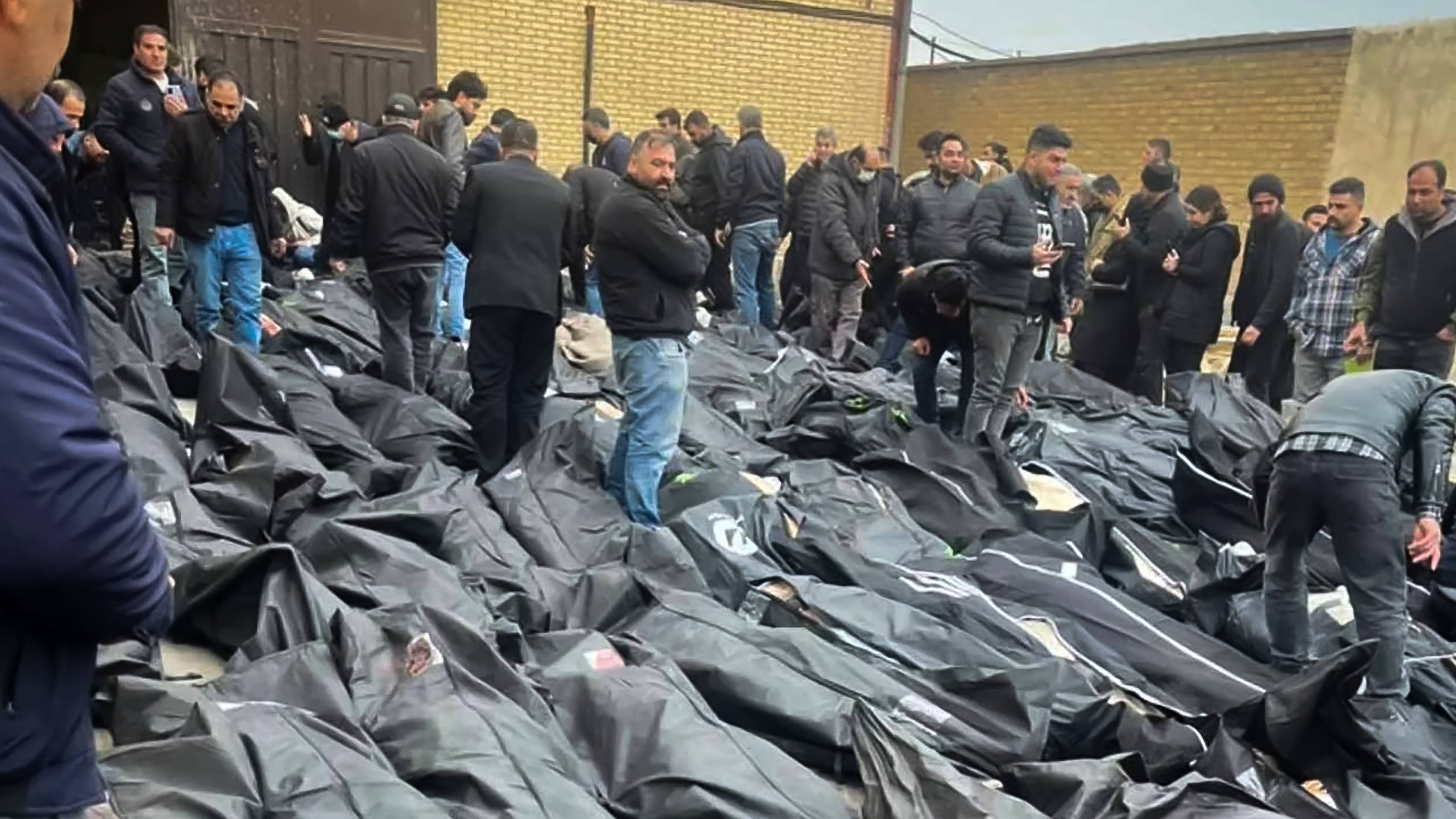 Families and residents at Kahrizak Coroner's Office confront rows of body bags after a violent crackdown on protests.