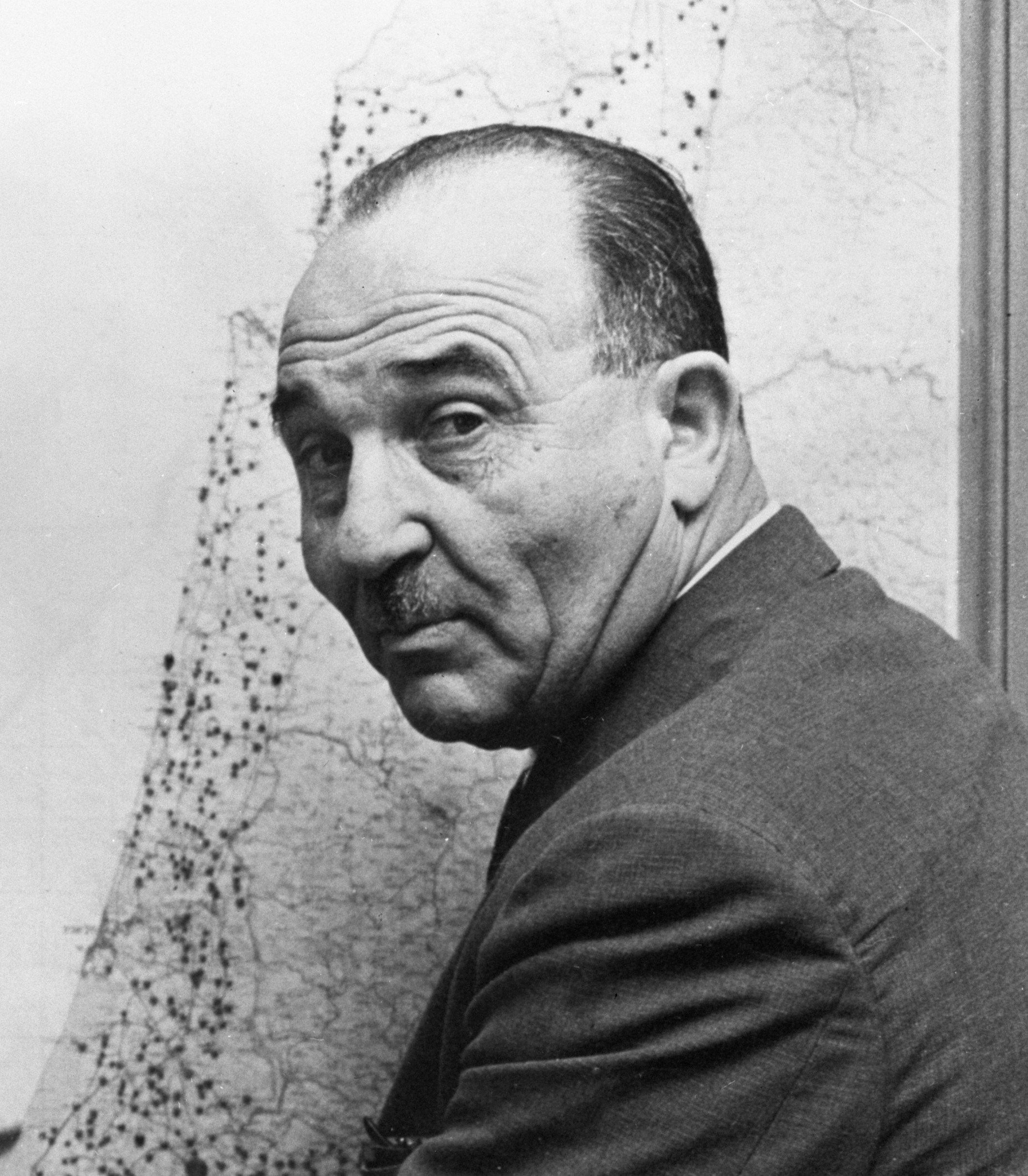 Oved Ben-Ami, Philip Klutznick, and Levi Eshkol looking at a proposed map of Ashdod.