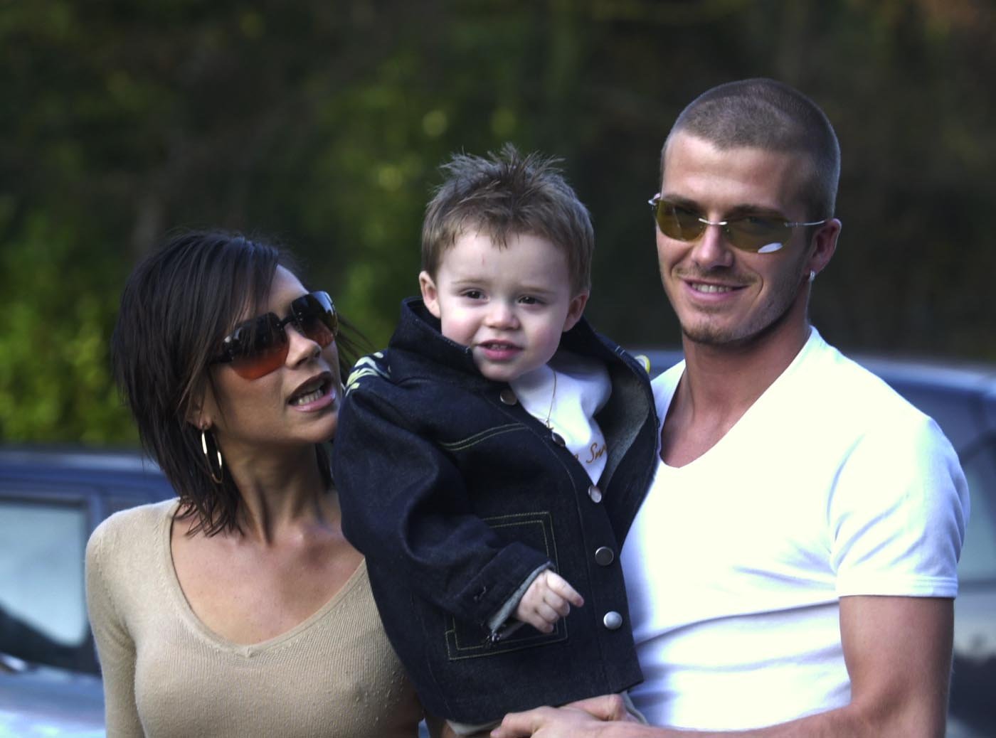 David Beckham and Victoria Beckham with their son Brooklyn at a birthday party.