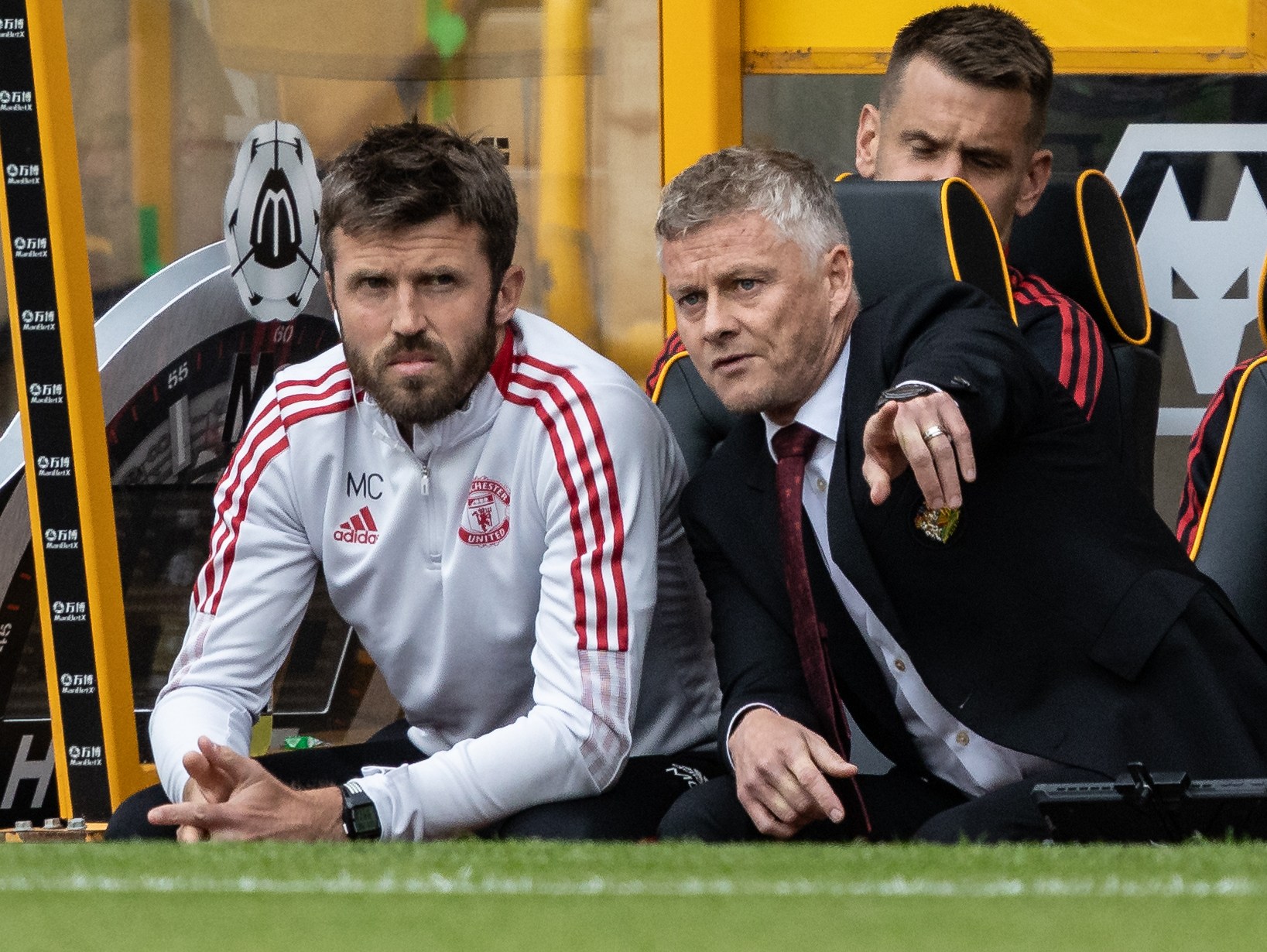 Manchester United coach Michael Carrick and manager Ole Gunnar Solskjaer in the dugout.