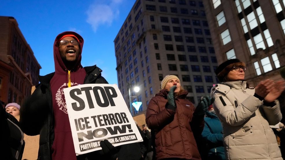 Protesters rally against the presence of U.S. Immigration Customs Enforcement in Maine, Friday, Jan. 23, 2026, in Portland, Maine. (AP Photo/Robert F. Bukaty)