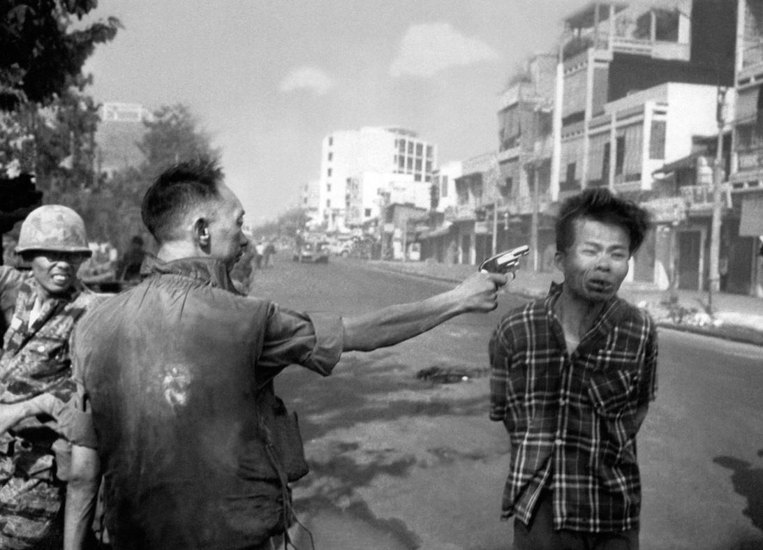 This Pulitzer-winning photograph from 1968 shows South Vietnamese General Nguyen Ngoc Loan, chief of the National Police, firing his pistol into the head of suspected Viet Cong officer Nguyen Van Lem (also known as Bay Lop) on a Saigon street.
