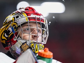 Carter George focuses on the droplets of water squirted from his bottle. It's one of the many routines the Owen Sound Attack goaltender has to reset his focus during a game. Sam Buschbeck/Sam Buschbeck Photography/Owen Sound Attack