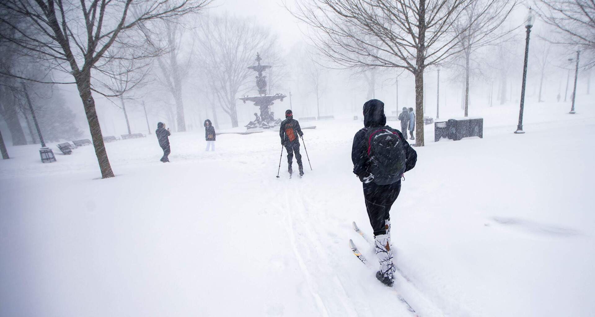 Two cross-country skiers make their way through Boston Common during a storm on Jan. 29, 2022 — the last time the city received over a foot of snow. (Jesse Costa/WBUR)