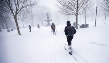 Two cross-country skiers make their way through Boston Common during a storm on Jan. 29, 2022 — the last time the city received over a foot of snow. (Jesse Costa/WBUR)