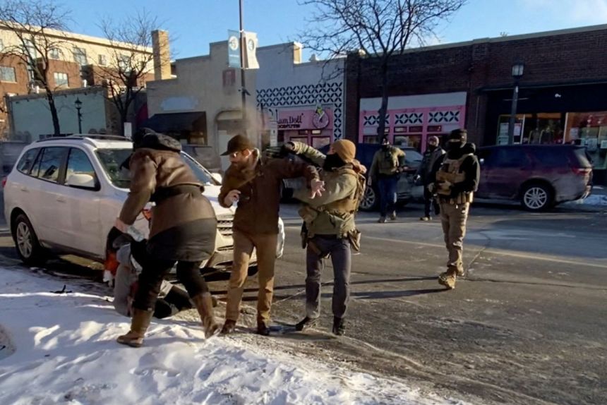 A screengrab from a video obtained by Reuters shows a law enforcement officer spraying irritants at Alex Pretti, before Pretti was fatally shot, in Minneapolis, Minnesota, on January 24.
