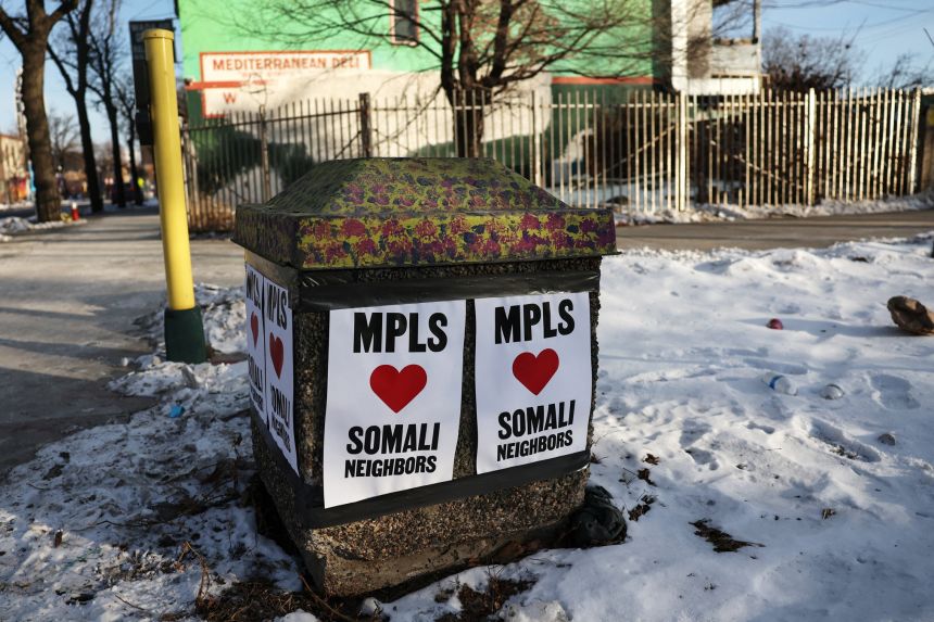 Signs in support of Somali residents hang along Cedar avenue in the Cedar-Riverside neighborhood of Minneapolis on January 26.