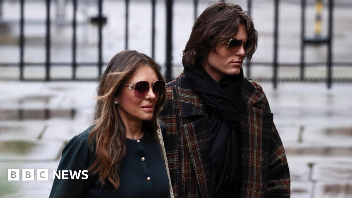 Actor Liz Hurley with her son Damian Hurley,  arriving at court. Both wear sunglasses and have neutral expressions.