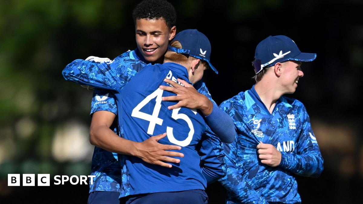 Manny Lumsden celebrates taking a wicket against New Zealand with his England team-mates