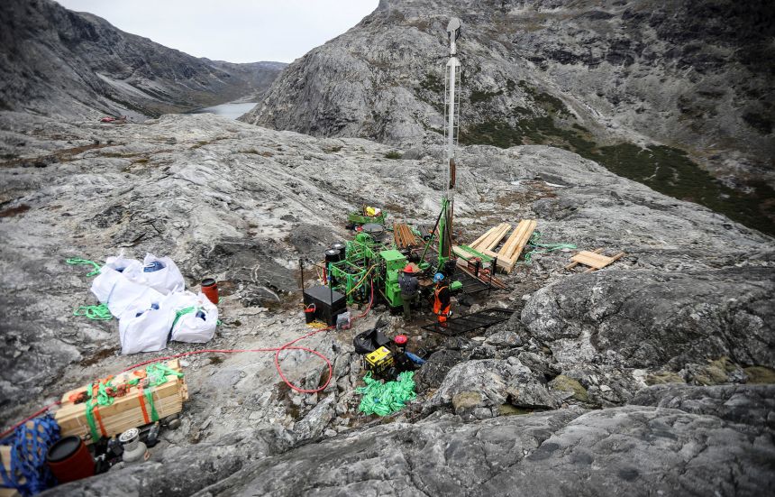 Workers drill at an exploration site close to the Qeqertarsuatsiaat fjord in Greenland, on September 11, 2021.