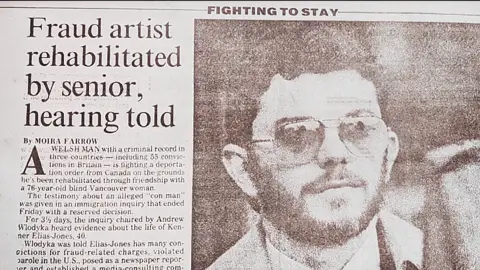 Cwmni Da/S4C A black and white newspaper clipping from the Vancouver Sun. The headline reads Fraud artist rehabilitated by senior, hearing told, and it describes an immigration hearing where Kenner Elias Jones is fighting deportation from Canada by saying he has been rehabilitated from his criminal past by his friendship with a blind 76-year-old woman.