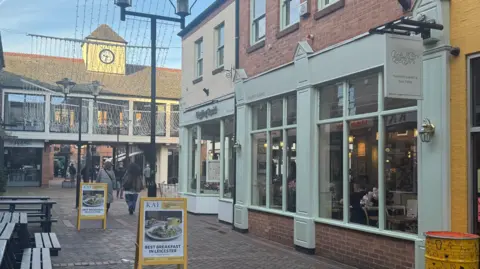 The outside of a restaurant in a pedestrianised square