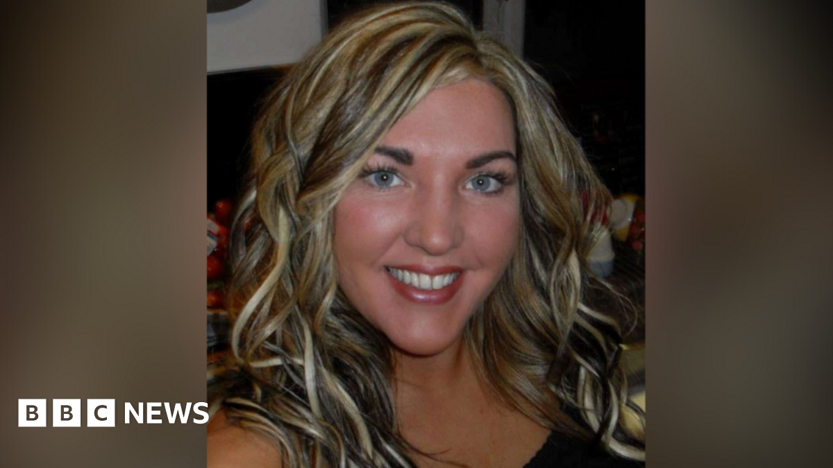 A handout image of Rachel Simpson. She is taking a selfie and has blonde, highlighted, curled hair. She is smiling at the camera.