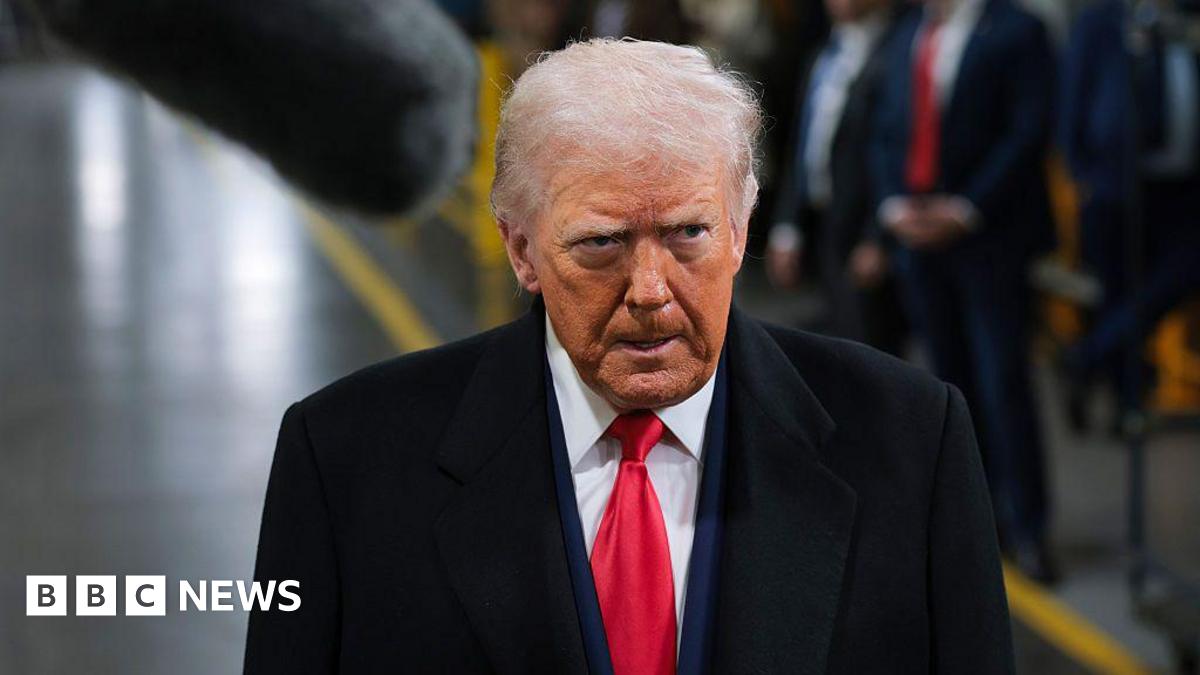 Black and white photos of Emma Barnett and John Simpson against a stylised background of dark orange and light orange. In the top left are two interlinked circles and the BBC logo in front of the words InDepth