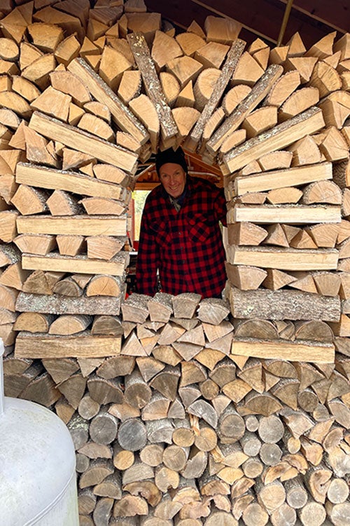 A friend of the author's peering out from inside the circular stacked holzhausen.