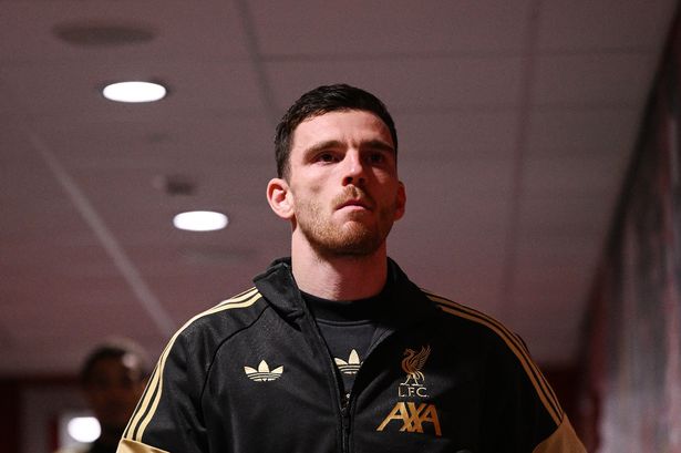 Andy Robertson arrives at a stadium