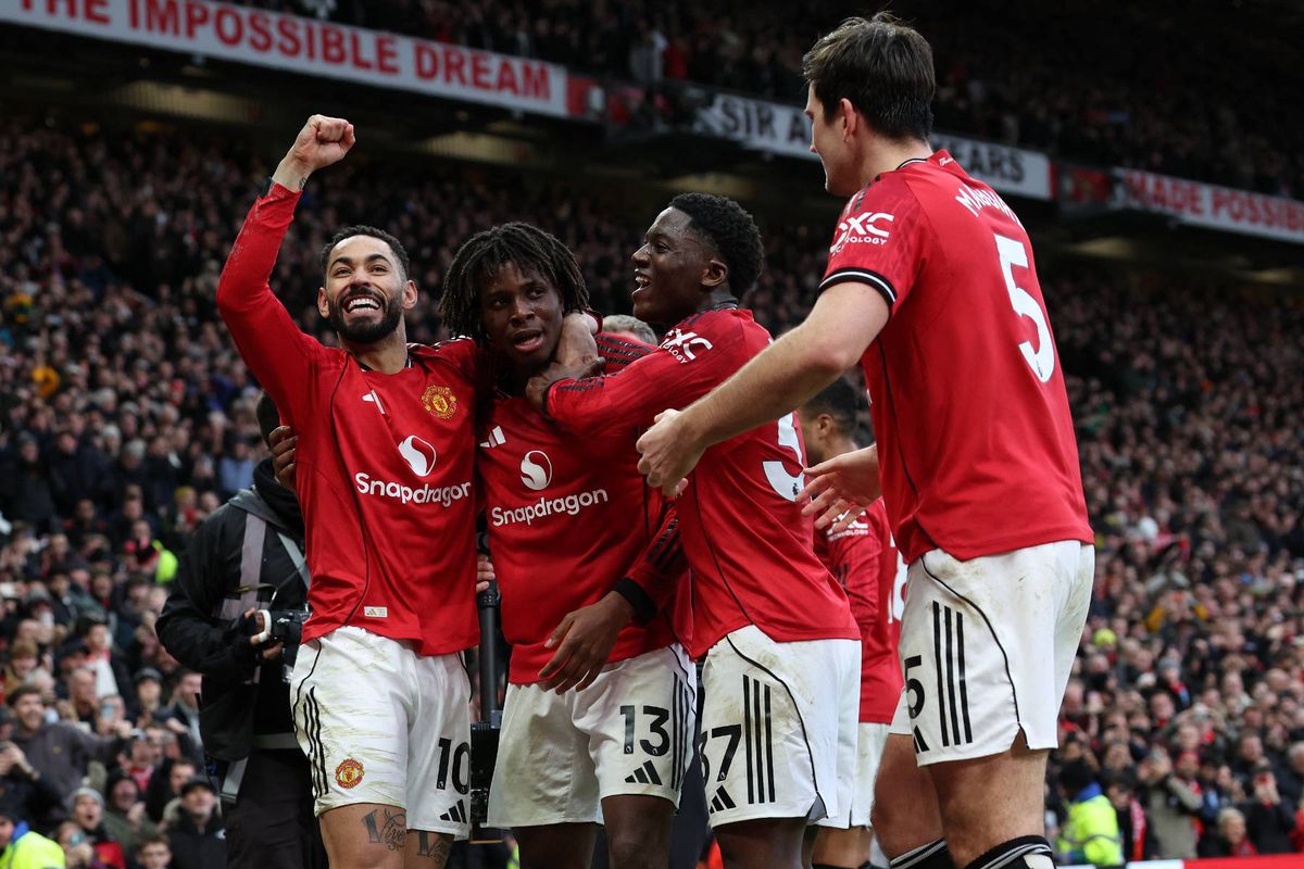 Manchester United's Danish defender #13 Patrick Dorgu (2L) celebrates with teammates after scoring their second goal during the English Premier League football match between Manchester United and Manchester City at Old Trafford in Manchester, north west England, on January 17, 2026.