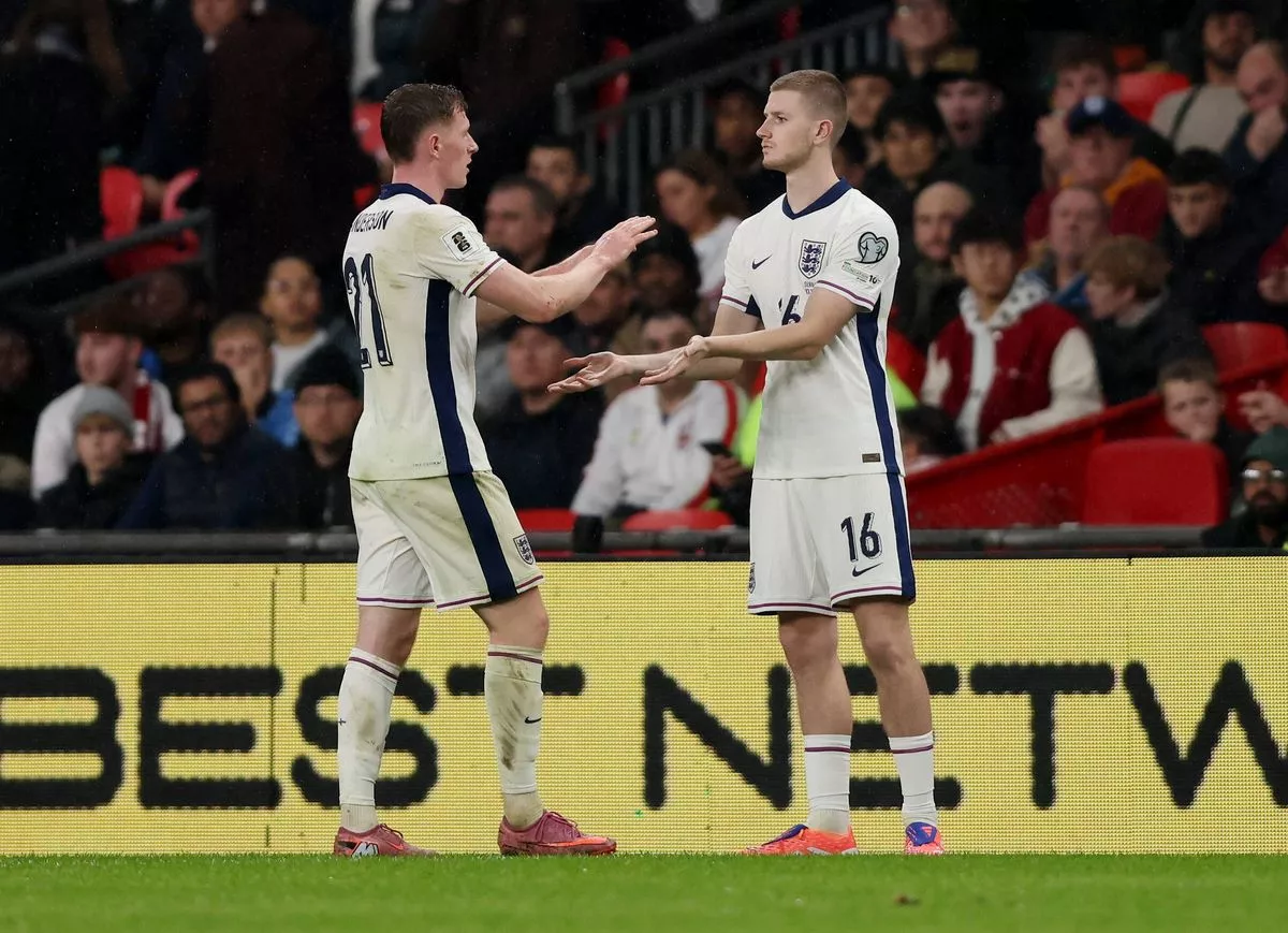 Elliot Anderson and Adam Wharton of England interact as they are substituted during the FIFA World Cup 2026 qualifier match between England and Serbia at Wembley Stadium on November 13, 2025 in London, England