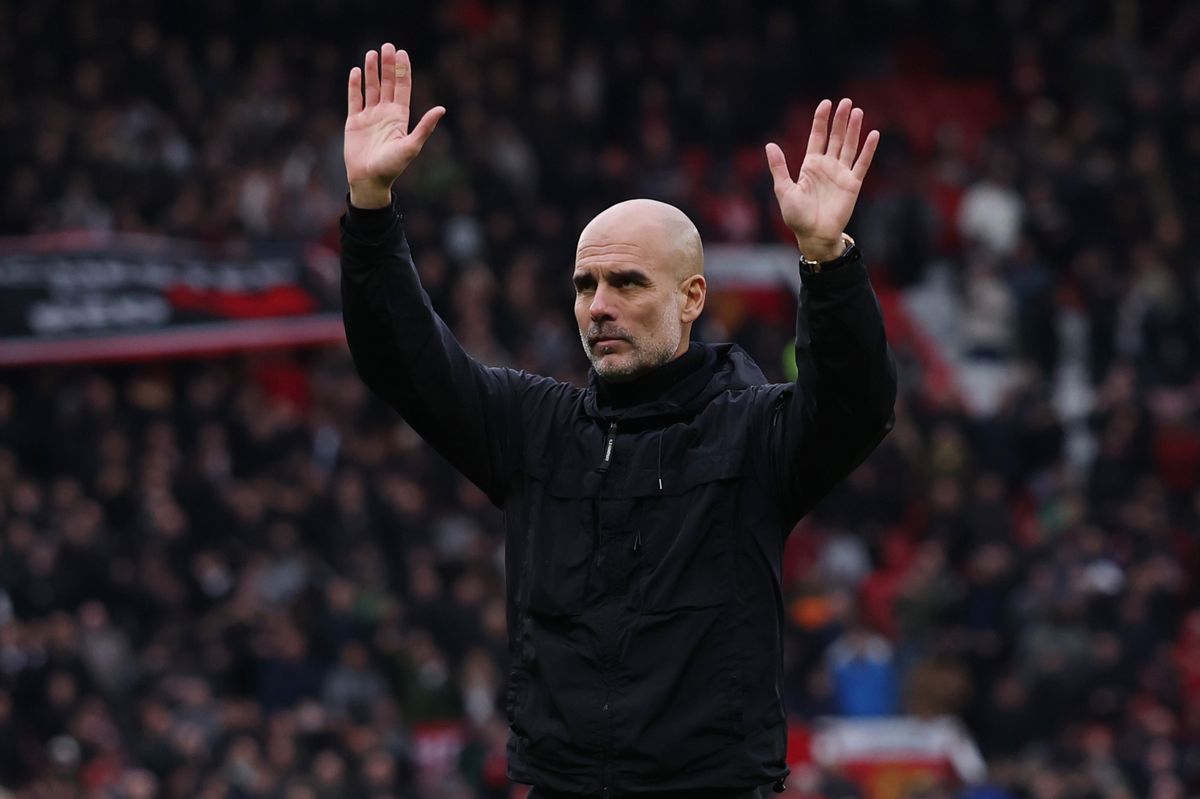 Pep Guardiola, manager of Manchester City, looks dejected after the team's defeat during the Premier League match between Manchester United and Manchester City at Old Trafford on January 17, 2026 