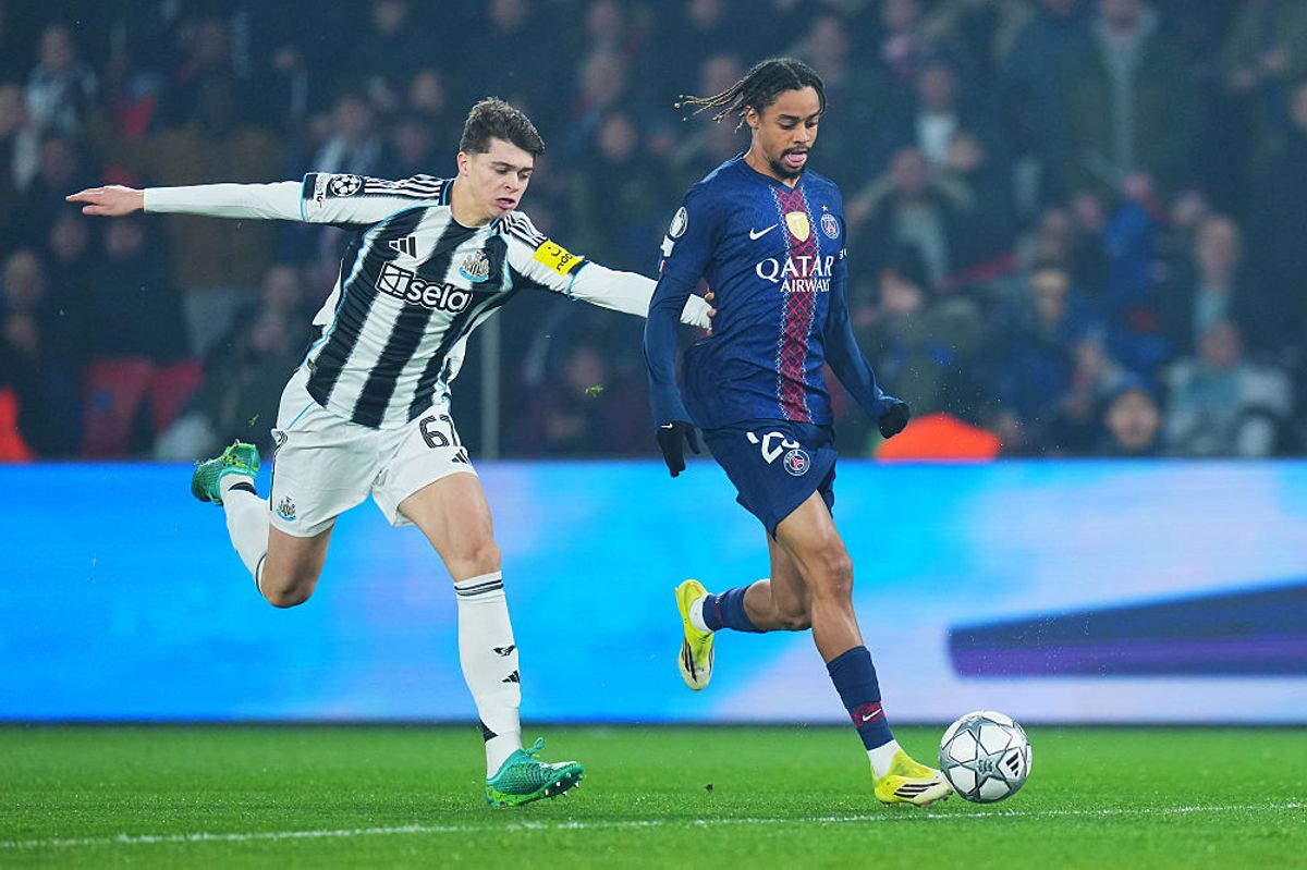 Bradley Barcola of Paris Saint-Germain runs with the ball while under pressure from Lewis Miley of Newcastle United 