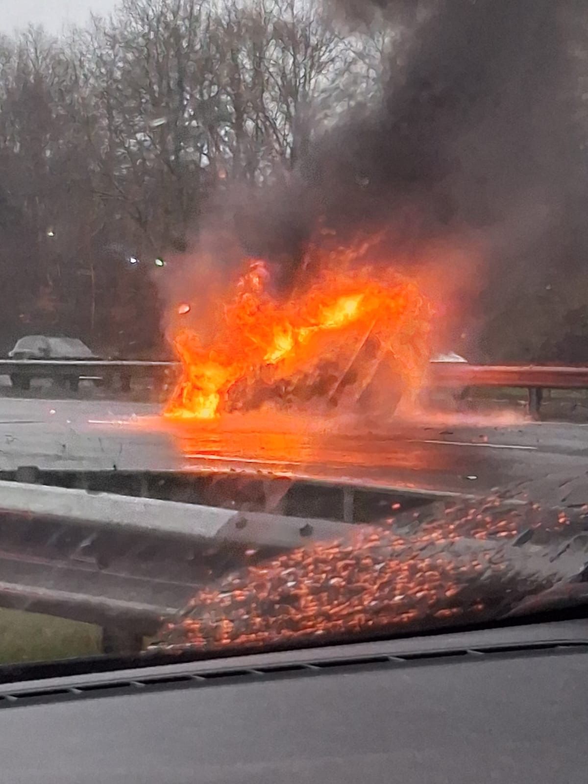 Emergency crews closed the motorway after the vehicle erupted into flames