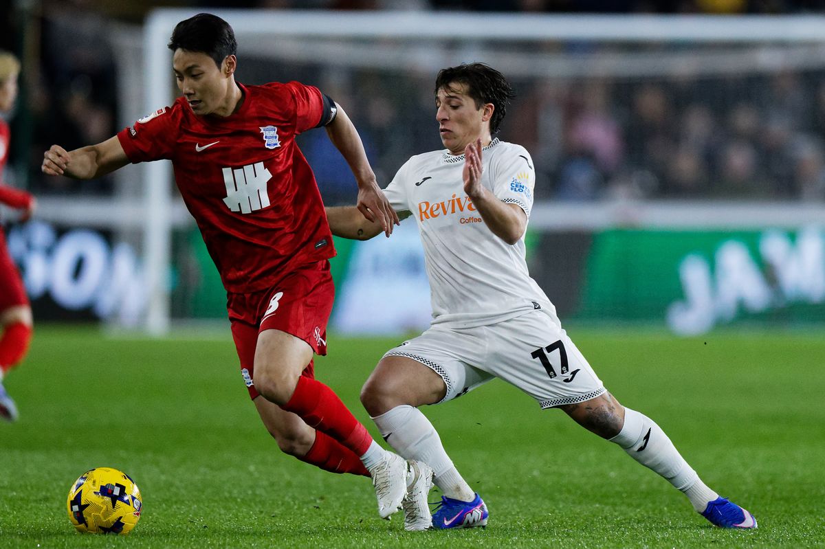 Paik Seung-ho of Birmingham City is chased by Goncalo Franco of Swansea City