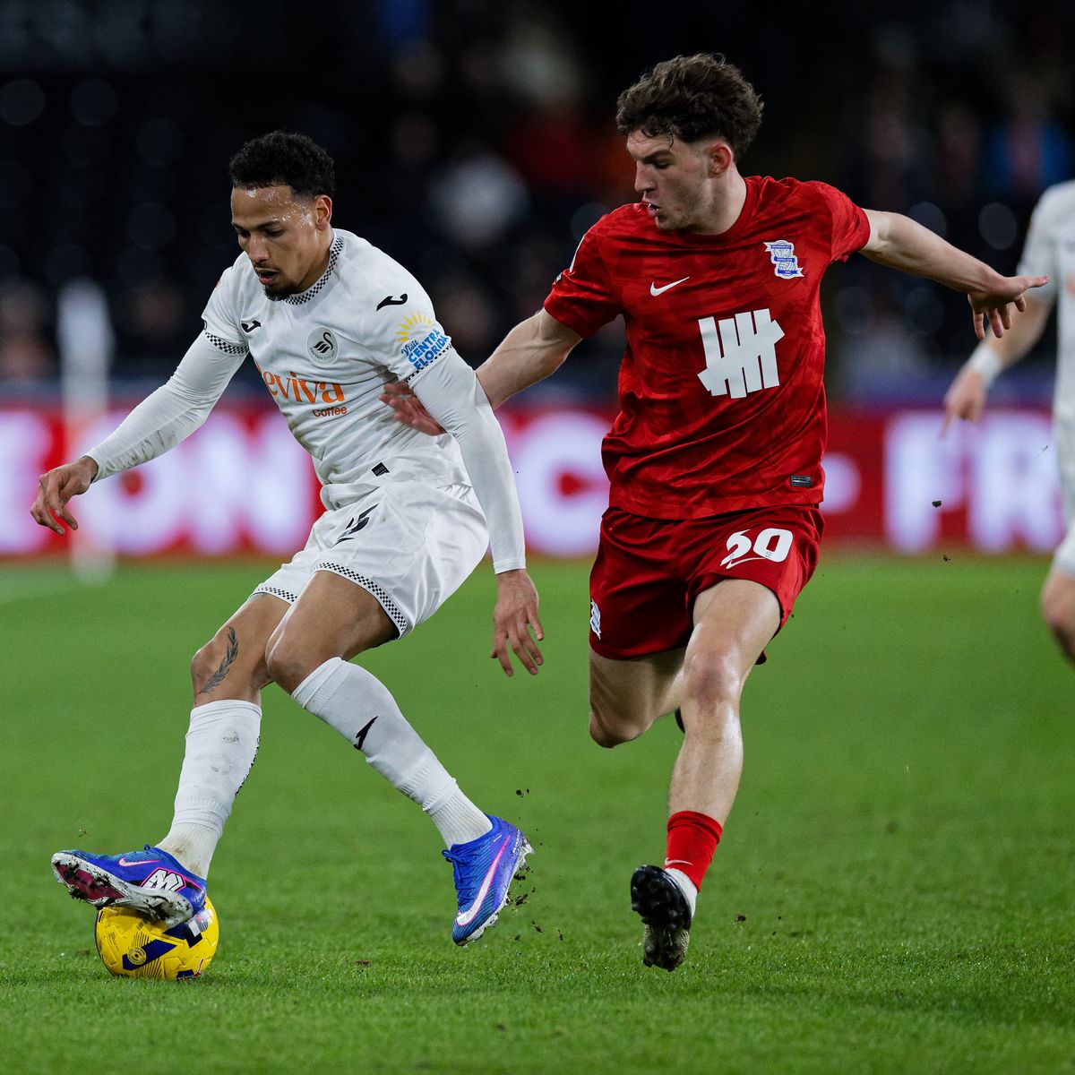 Ronald of Swansea City and Lewis Koumas of Birmingham City in action during the Sky Bet Championship match between Swansea City and Birmingham City at the Swansea.com Stadium