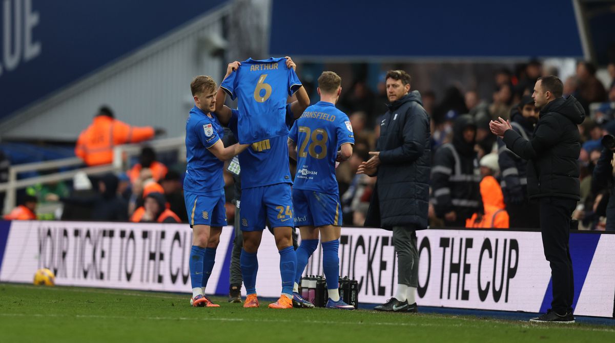 Tomoki Iwata of Birmingham holds a shirt up in memory of Arthur Labinjo-Hughes after he scores their first goal during the Sky Bet Championship match between Birmingham City and Stoke City at St Andrew’s at Knighthead Park