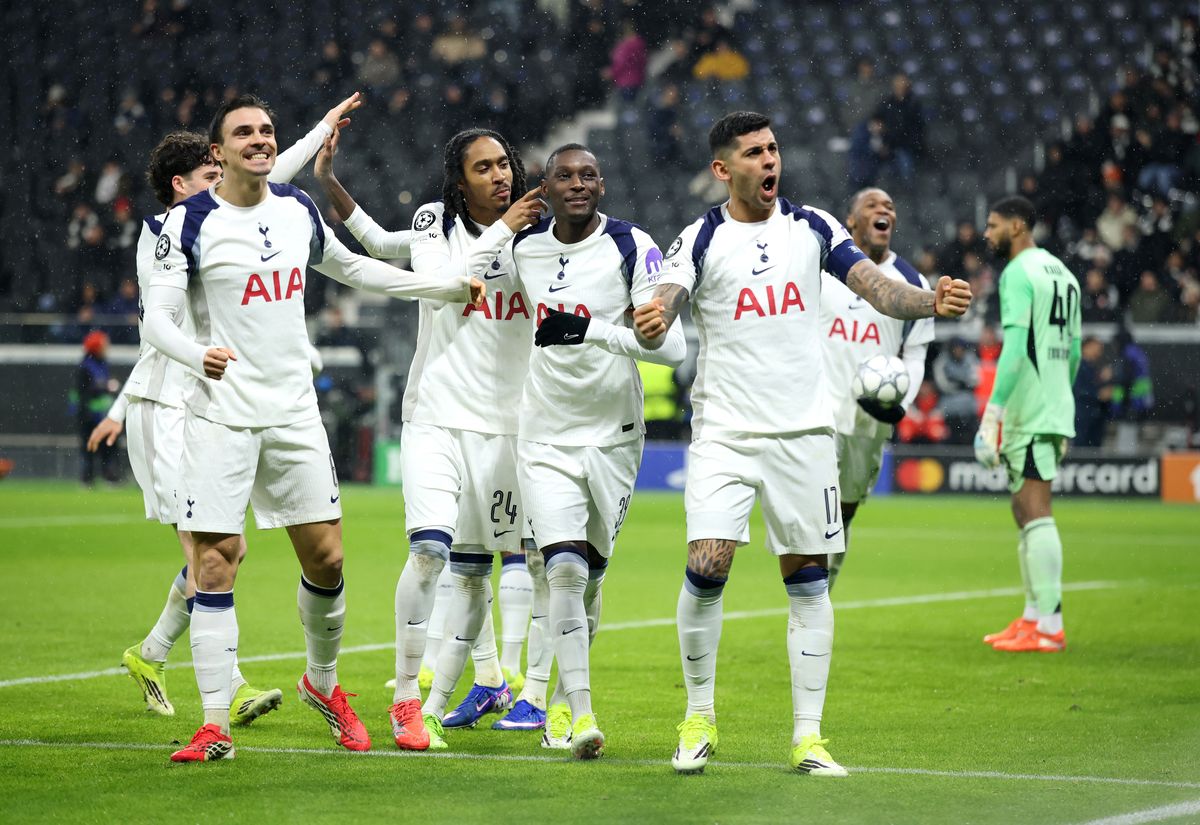 Randal Kolo Muani of Tottenham Hotspur celebrates scoring his team's first goal with teammates during the UEFA Champions League 2025/26 League Phase MD8 match between Eintracht Frankfurt and Tottenham Hotspur at Frankfurt Stadion on January 28, 2026 in Frankfurt am Main, Germany