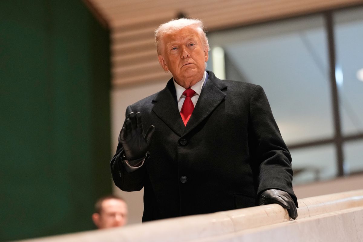 President Donald Trump walks down the stairs after a meeting during the Annual Meeting of the World Economic Forum in Davos, Switzerland, Wednesday, Jan. 21, 2026. (AP Photo/Markus Schreiber)
