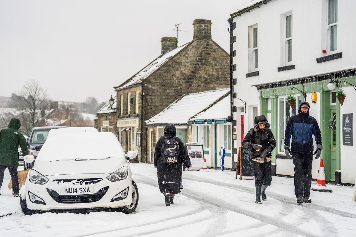 People in snowy conditions in Goathland in the North York Moors National Park, as warnings for snow, ice, wind and rain remain in force for the weekend as the UK braces for further wintry weather following Storm Goretti. Picture date: Sunday January 11, 2026. PA Photo. Photo credit should read: Danny Lawson/PA Wire