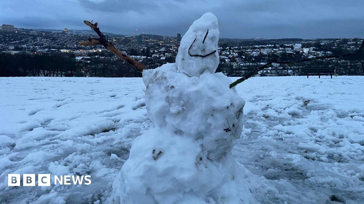 Workers clear the platform at Buxton trian station