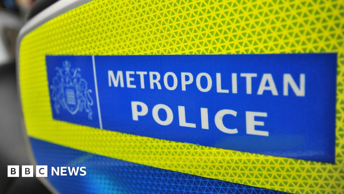 The Metropolitan Police sign on the side of a police motorcycle