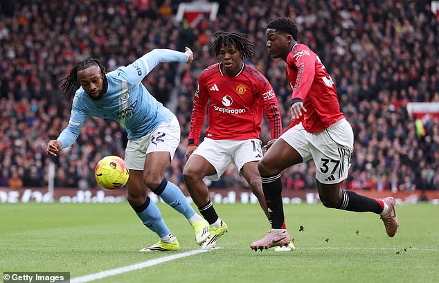 Kobbie Mainoo (right) was entrusted with the No6 role by Carrick in his first match