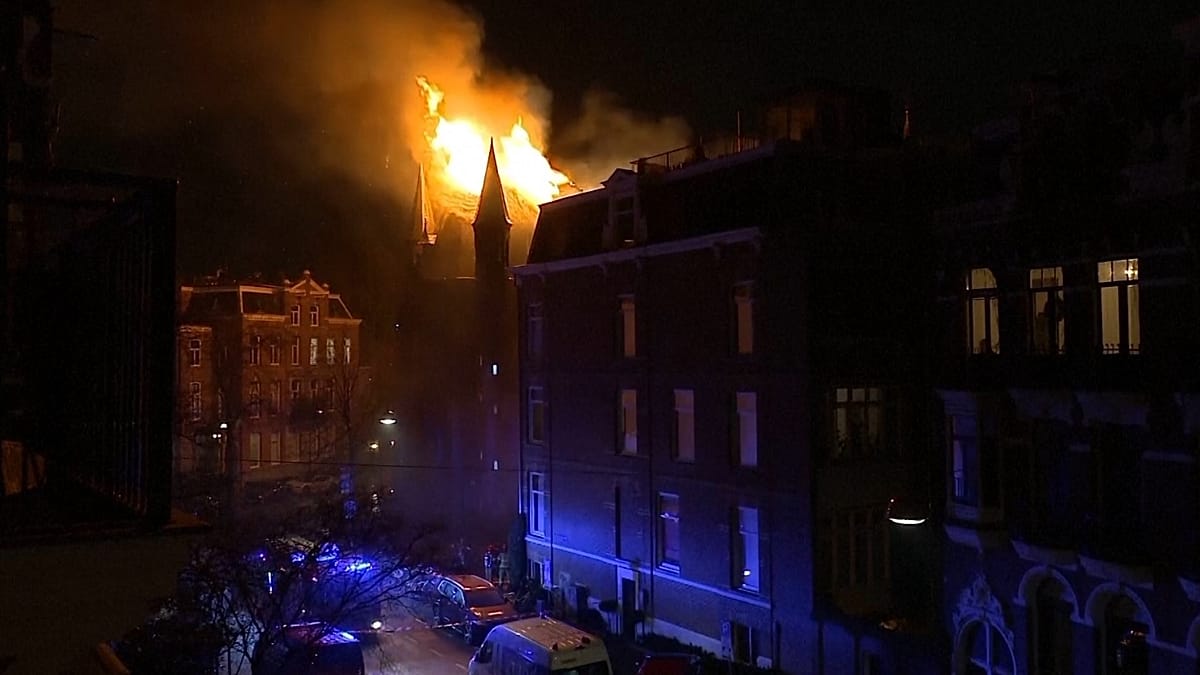 Two dead and church gutted by fire in 'unprecedented' New Year's violence in the Netherlands