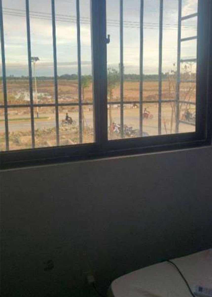 Photos taken inside Dex’s Borey Boao compound show his dormitory room, where barred windows frame the confined conditions of life inside the compound.