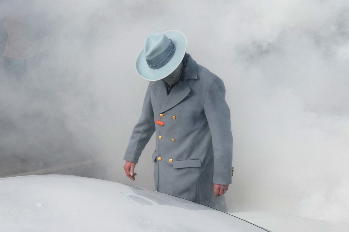 A person stands among a cloud of smoke from a riot-control grenade thrown by a federal agent in Minneapolis on January 12.