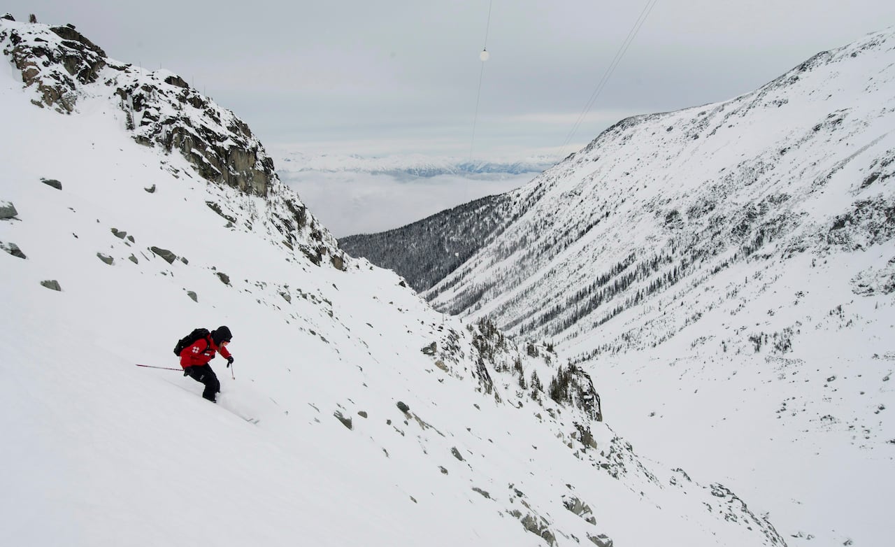Skier going down a huge mountain