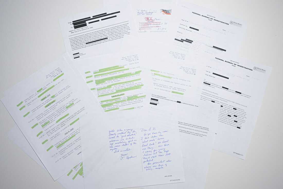 This photo illustration shows a new batch of files released in December by the U.S. government in relation to the late sex offender Jeffrey Epstein. A first batch was made public December 19, 2025 amid fierce criticism that the US Justice Department was deliberately slow-walking the release and excluding any references to US President Donald Trump. The latest slew of documents contains 8,000 files, including hundreds of videos or audio recordings. This includes surveillance footage from August 2019, the month Epstein was found dead in his jail cell -- and declared to have committed suicide. (Photo by AFP via Getty Images)