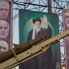A domestically-built missile and banners showing portraits of the Iranian Supreme Leader Ayatollah Ali Khamenei, center, and armed forces commanders who were killed in an Israeli strike in June, are displayed in Baharestan Square, Tehran, Thursday, Sept. 25, 2025.