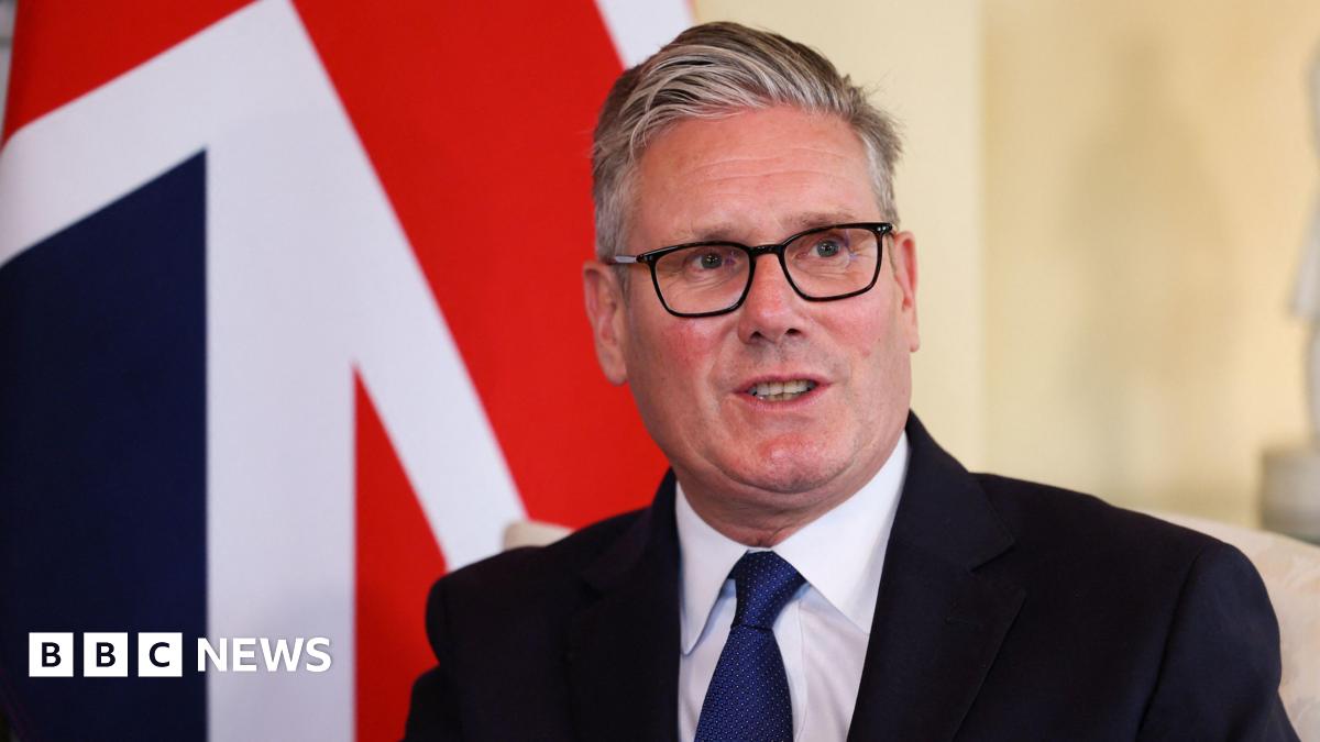 Keir Starmer in front of a Union Jack flag