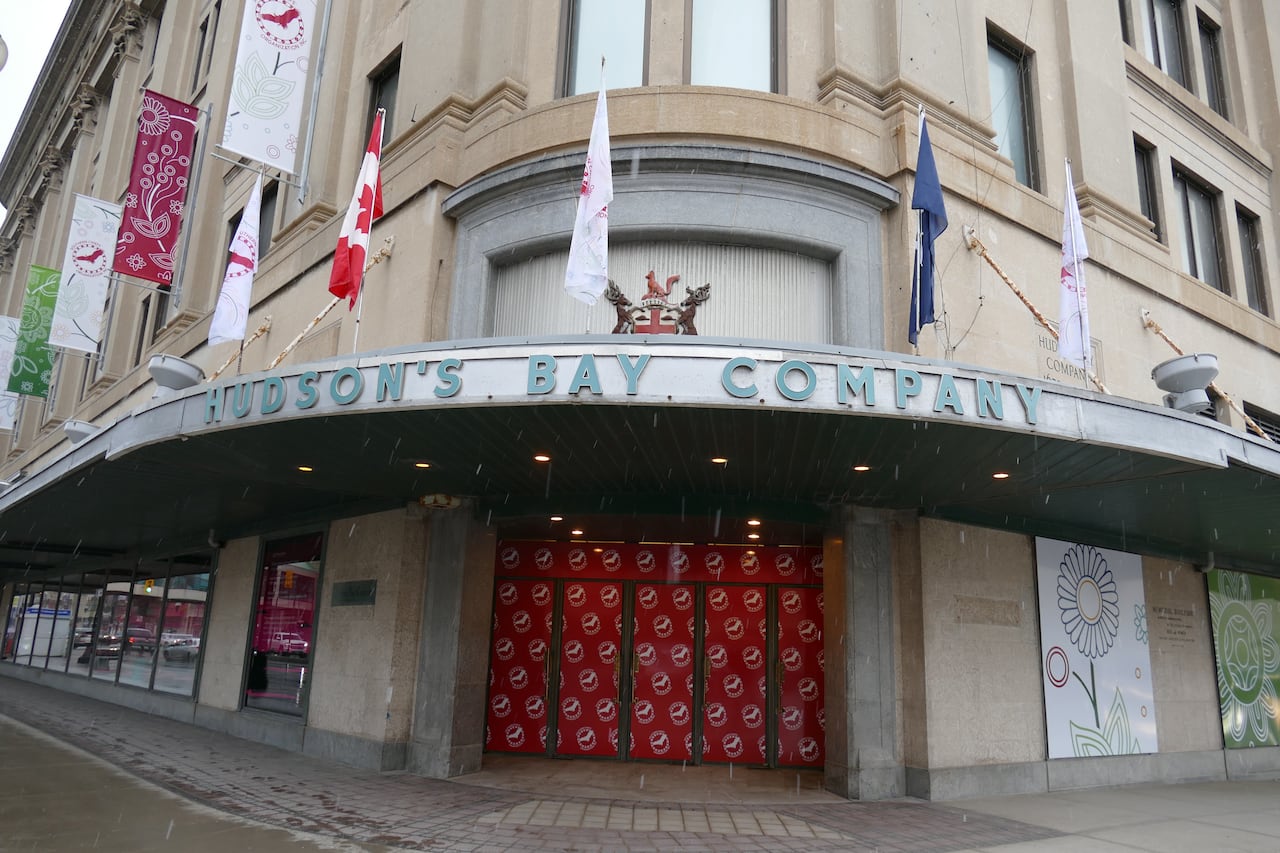 A building with a boarded-up entrance.