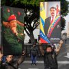 Government supporters display posters of Venezuelan President Nicolás Maduro, right, and former President Hugo Chávez in downtown Caracas, Venezuela, Saturday, Jan. 3, 2026, after U.S. President Donald Trump announced that Maduro had been captured and flown out of the country. 