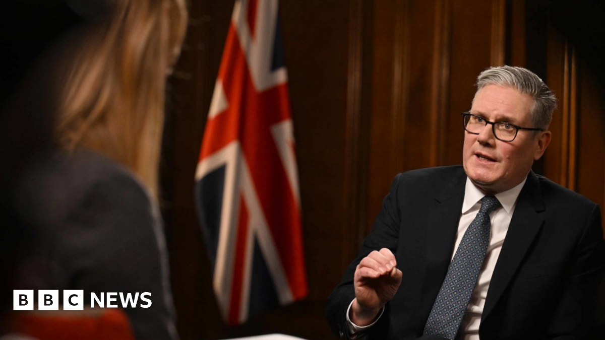Prime Minister Sir Keir Starmer being interviewed by Laura Kuenssberg for the BBC's Sunday with Laura Kuenssberg programme. He wears a black suit, a white shirt and a navy patterned tie.