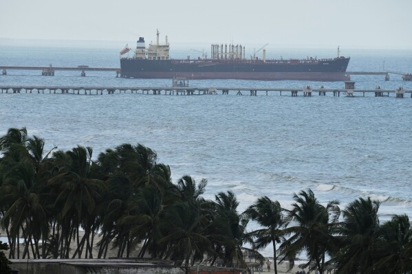 Evana, an oil tanker, is docked at El Palito port in Puerto Cabello, Venezuela, Sunday, Dec. 21, 2025. (AP Photo/Matias Delacroix)