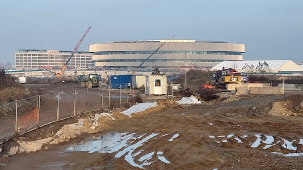 Milan construction workers put on brave face as race to finish Olympic hockey arena comes down to the wire