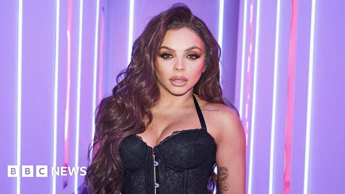 Jesy Nelson pictured in 2023, she is wearing a black jacket and had her hair up.